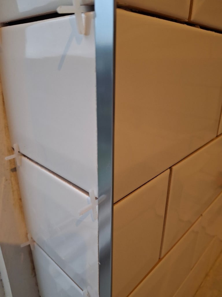 Silver tile trims