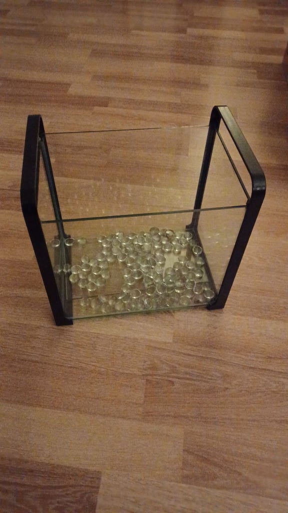 Small aquarium with glass pebbles