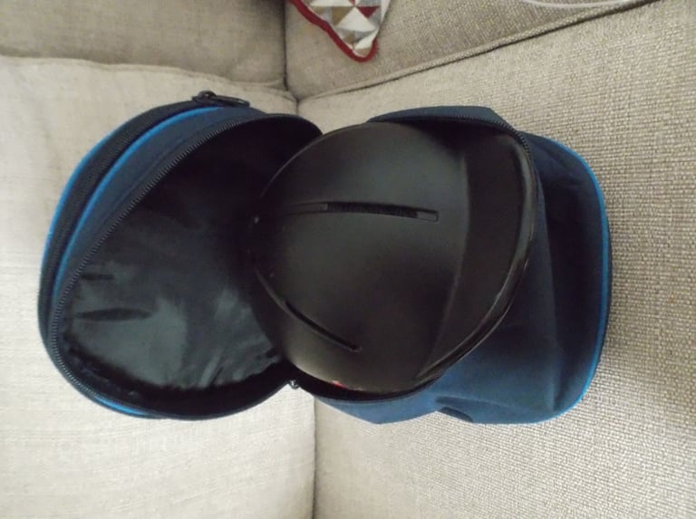 Childs horse riding safety helmet and storage bag