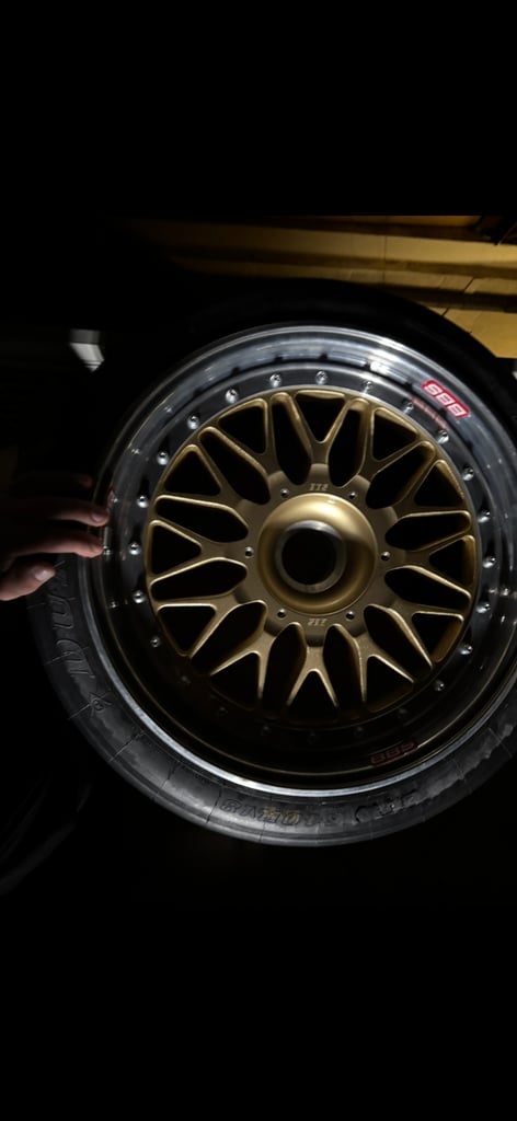 BBS racing wheels with brand new slicks on them.