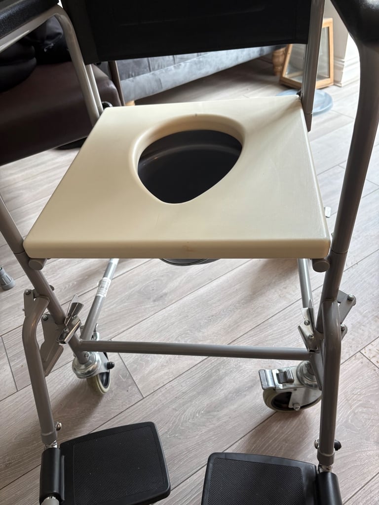 Commode on wheels never used 