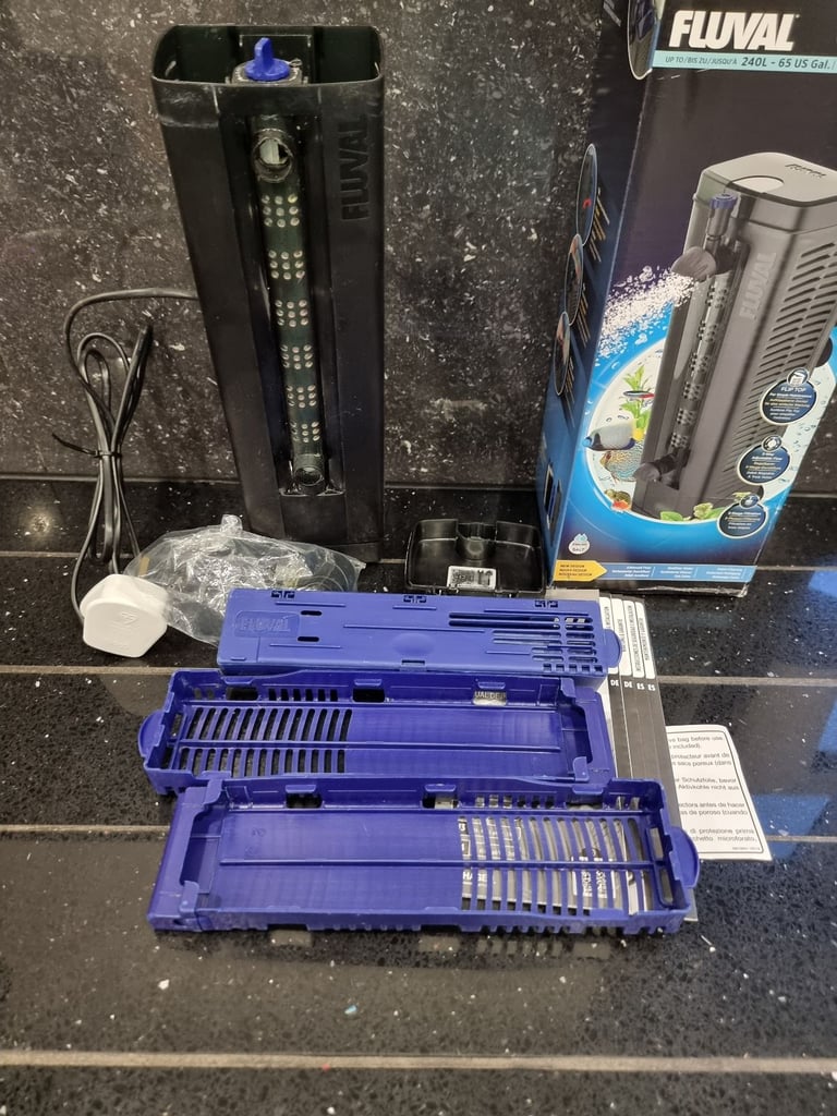 Fluval U4 underwater filter, thermometer and faux stone decoration