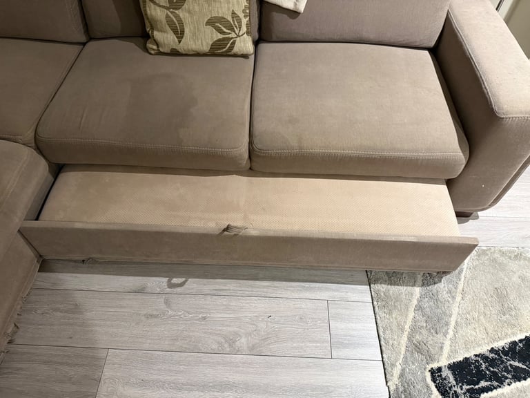 Beige corner sofa pulls out to sofabed