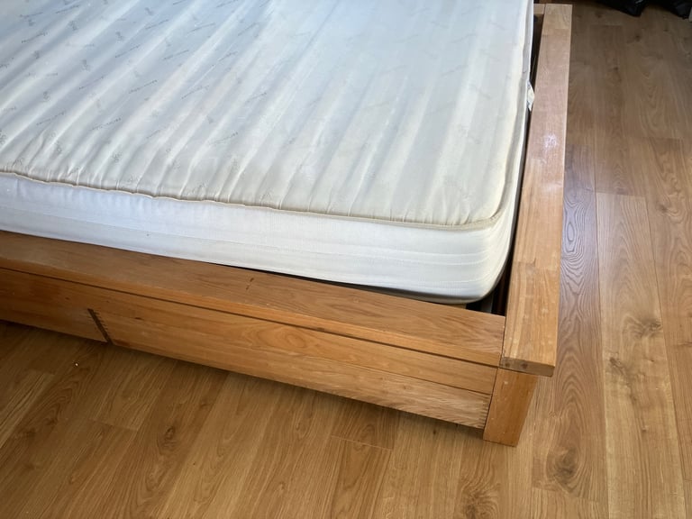 Oak King Size Wooden bed frame with four underbed wheeled drawers 