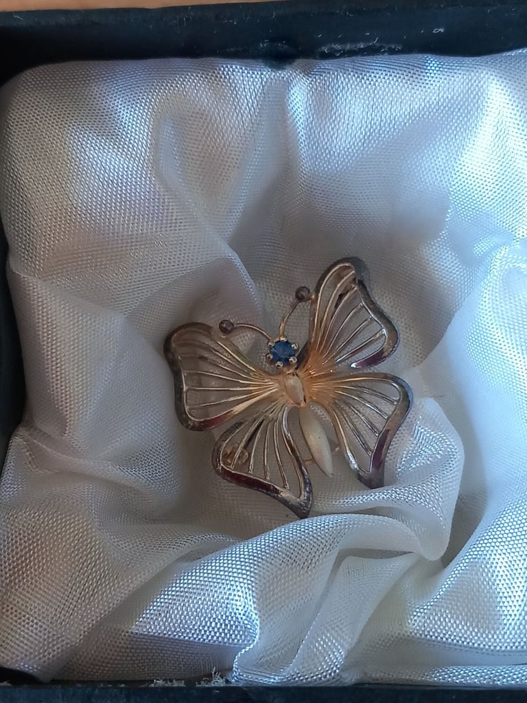 Silver coloured filigree effect Butterfly brooch with blue stone, reduced price