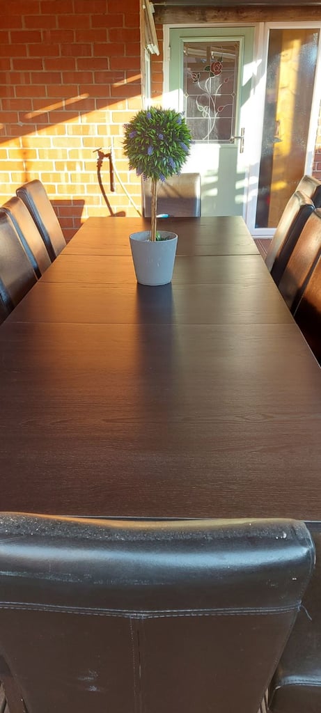 Large table and 12 brown chairs