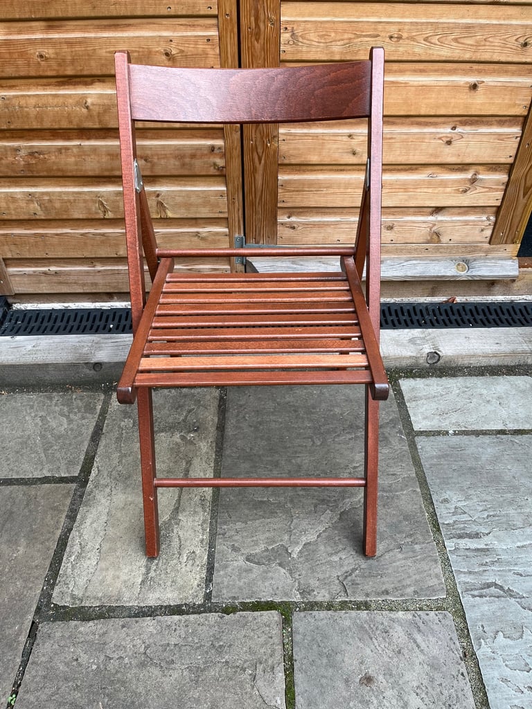 image for A hardly used wooden folding chair with latted seat.