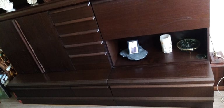 Dark brown storage/ display/ cocktail bar combination wall cabinet.