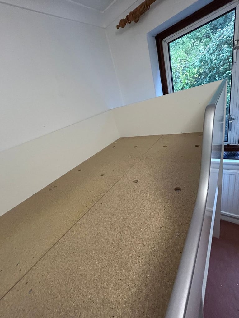 Cabin bed with built-in wardrobe and workstation. 