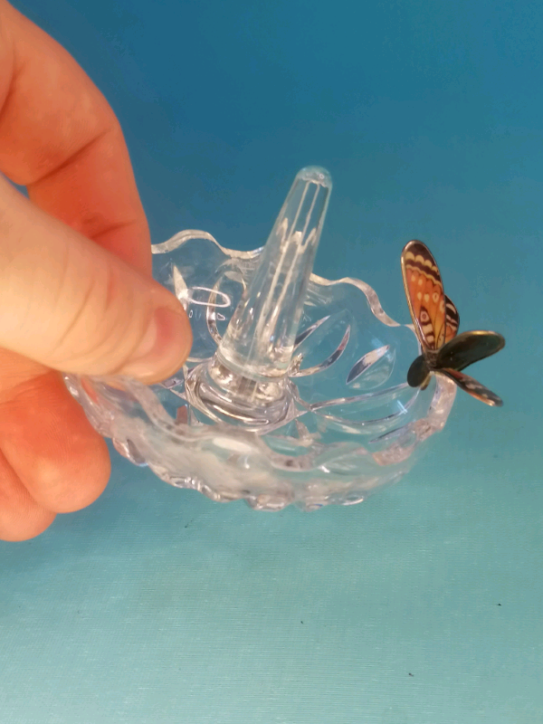 Glass ring holder with butterfly on  a side..