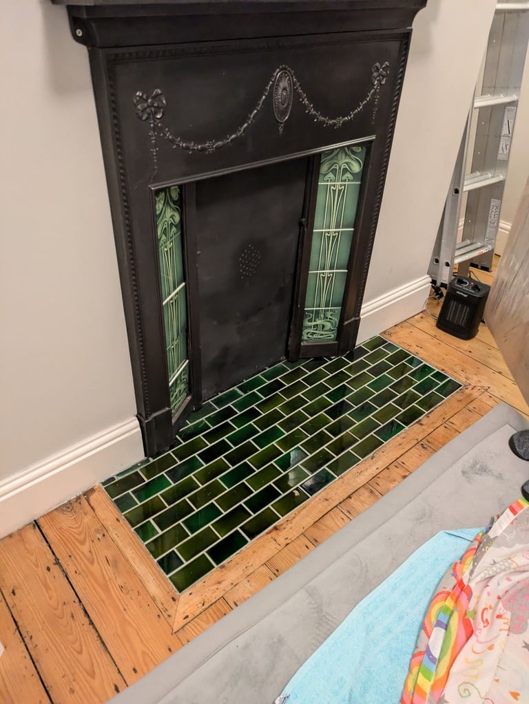 image for Cast iron Fireplace Mantel with green tiles inserts.