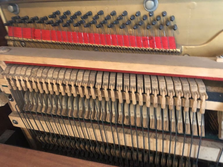 Upright Piano by Stanley Brinsmead London, 7 Octaves, 88 keys, dark wood.  Good condition.