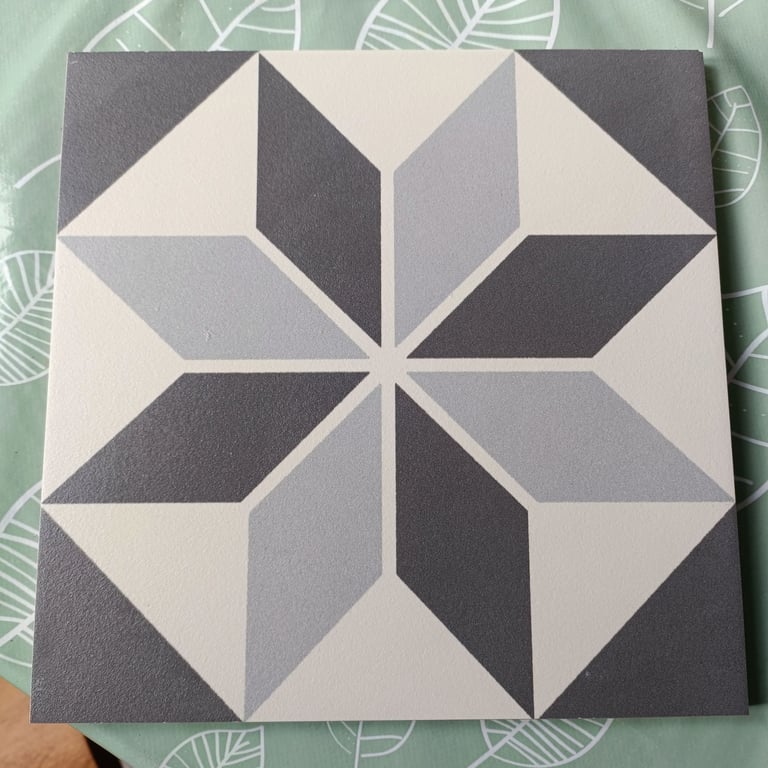 One box of grey patterned glazed porcelain floor and wall tiles