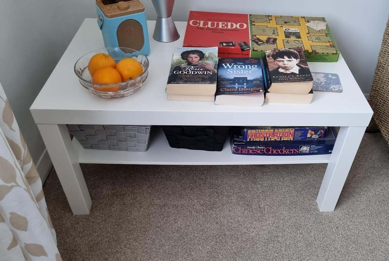 White coffee table, one shelf, could be used as a TV table. 