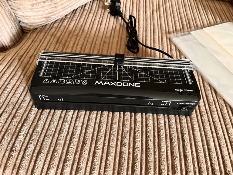 image for New laminator with different sized laminating paper 