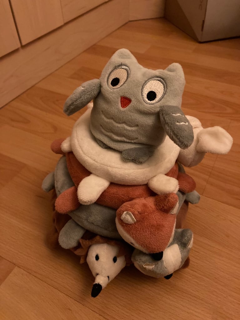 Selection of soft toys inc Peter rabbit bunny, giraffe, Winnie the Pooh and animal stacking ring