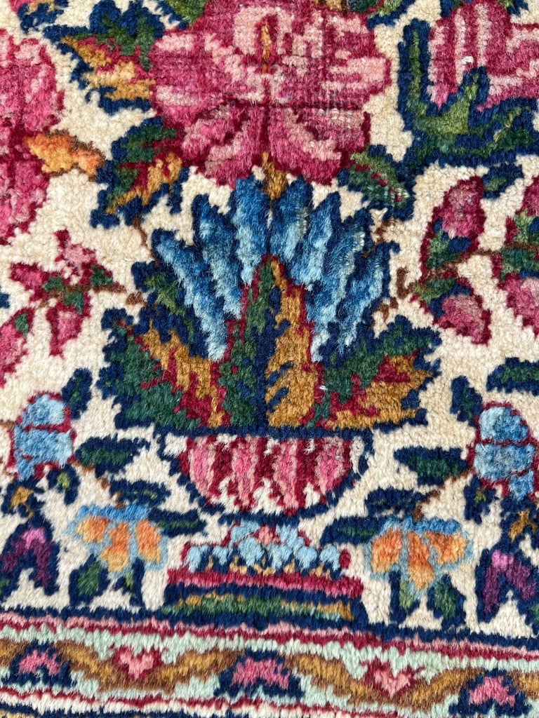 A pair of Antique Kirman mats 
