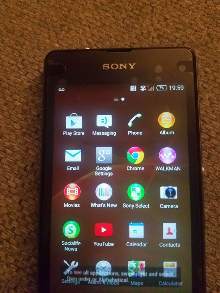 Black sony mobile with charger