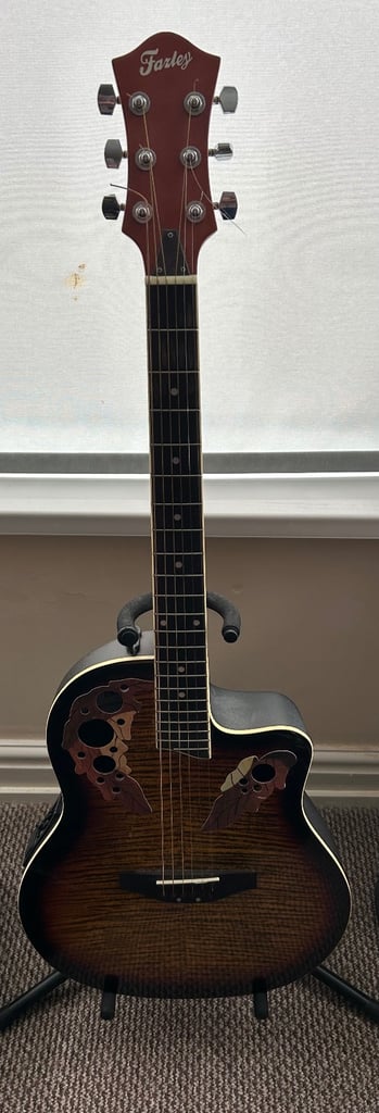image for Fazley electro acoustic with padded case, stand, book and accessories.