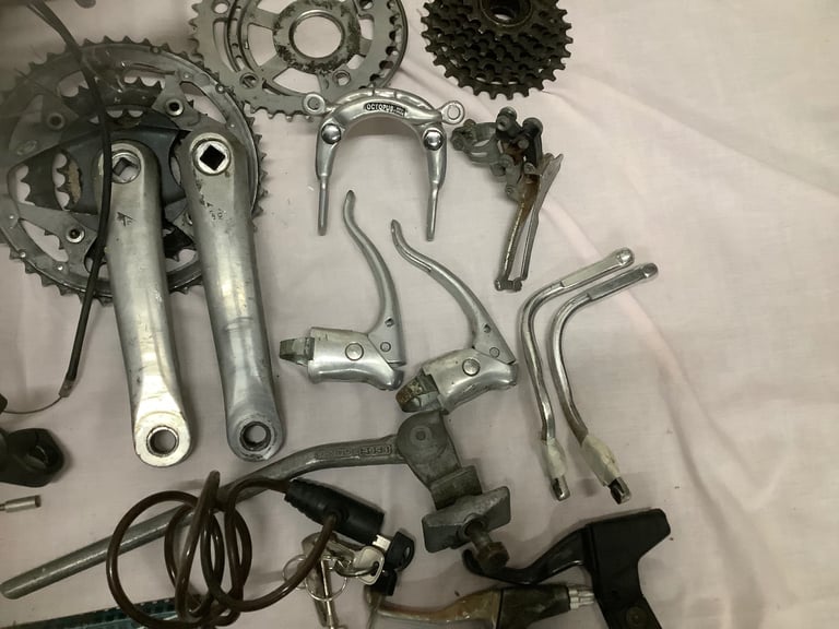 JOB LOT of Bicycle Parts. Handlebars, pumps, brakes, gear shifters and more.