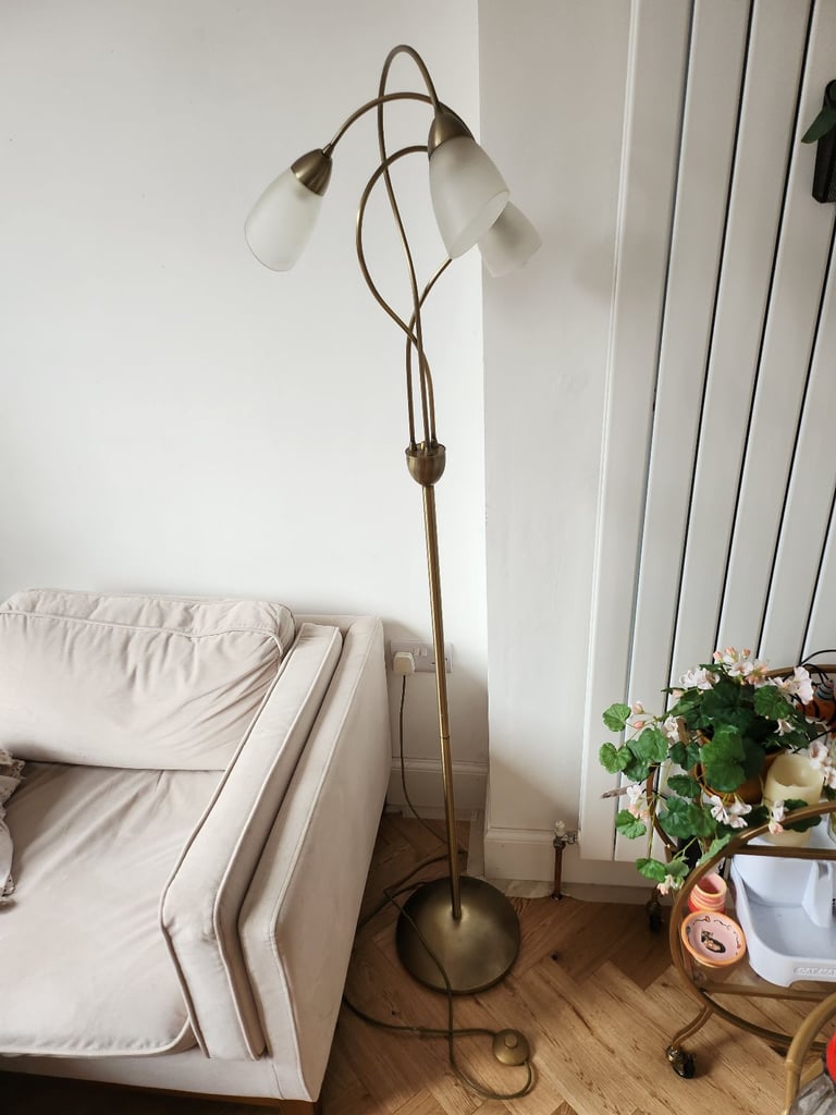Tall gold floor lamp