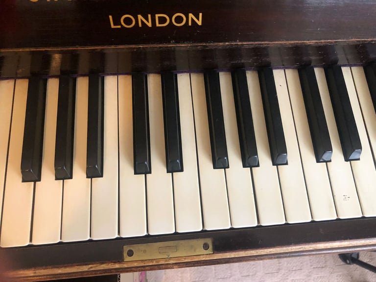 Upright Piano by Stanley Brinsmead London, 7 Octaves, 88 keys, dark wood.  Good condition.