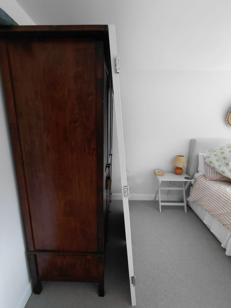 Painted white wardrobe doors with hinges and handles