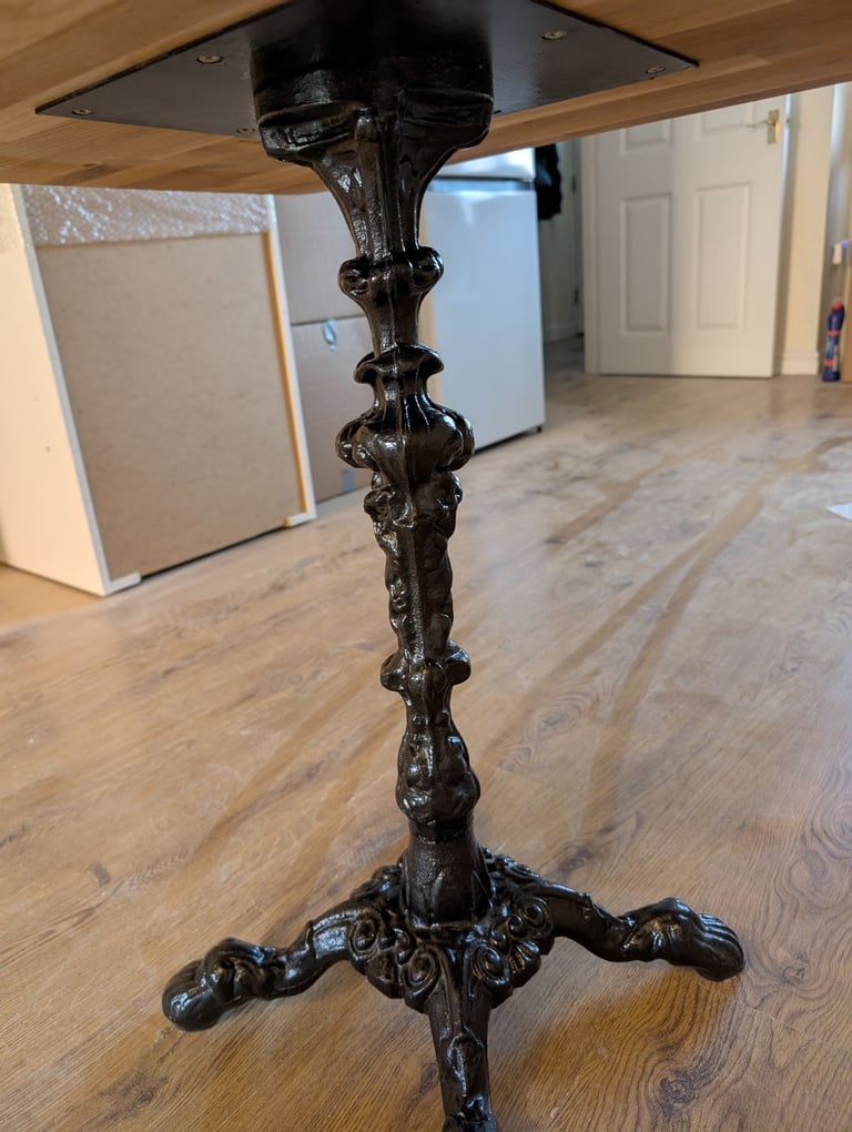 Solid Oak dinner table with cast iron base