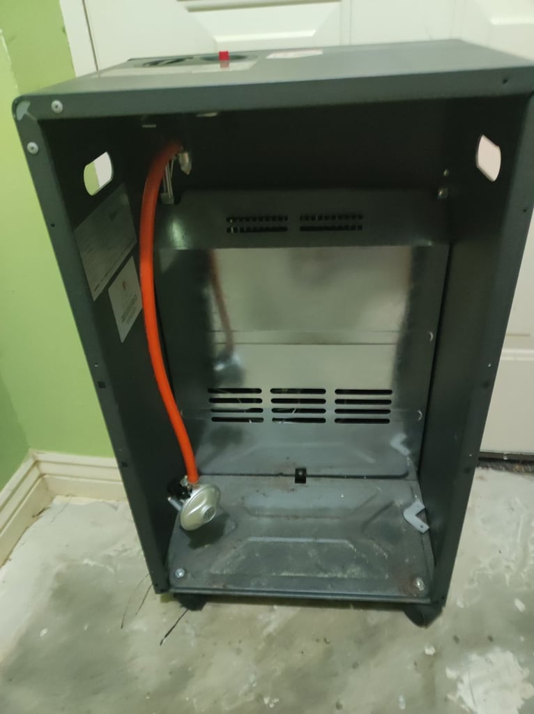 Gas depot , portable gas heater on wheels, plus 2 flo gas canisters 