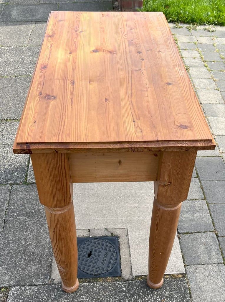 A CHUNKY SOLID PINE SIDE TABLE WITH WHEATSHEAF MOULDINGS