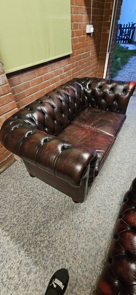 Beautiful vintage 2 seater chesterfield sofa with matching footstool.