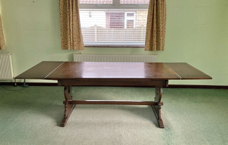 Dark mahogany finish dining table and six chairs