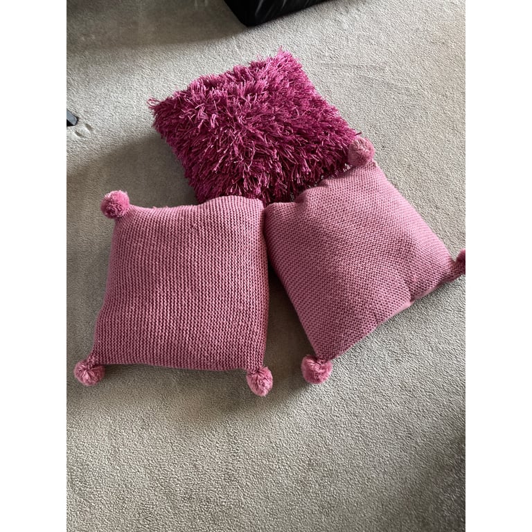 Three purple cushions 