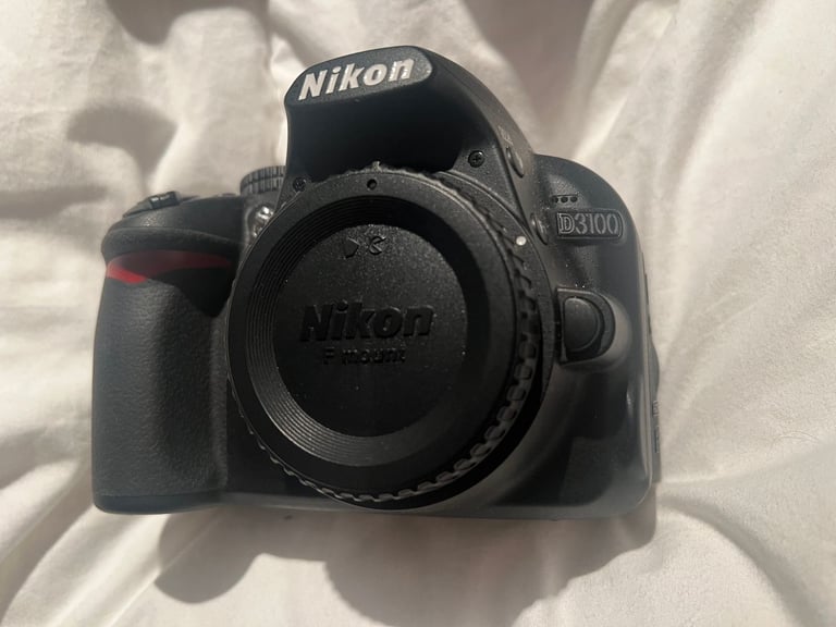 Nikon D3100 DSLR + 18-55mm VR Lens + Charger + Bag