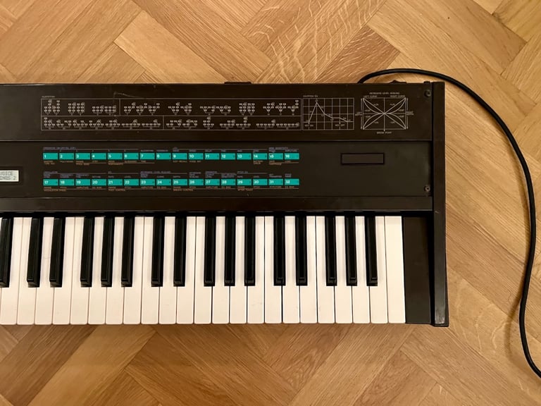 Yamaha DX7 Synthesizer Mk1 with original stand, soft case and manual.