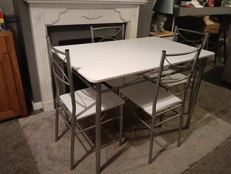 White dining table and four chairs feel free to contact me 