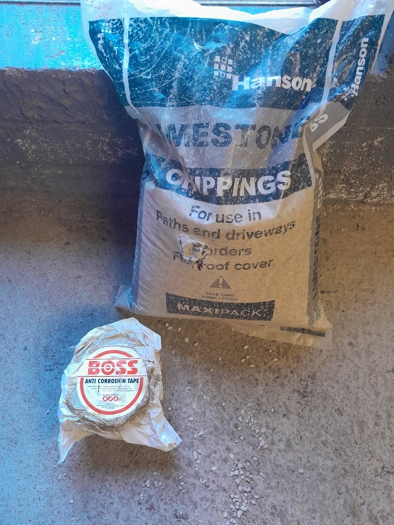 image for Full Roll Denso Protective Tape and Nearly Full bag Of Lime Soakaway Chippings