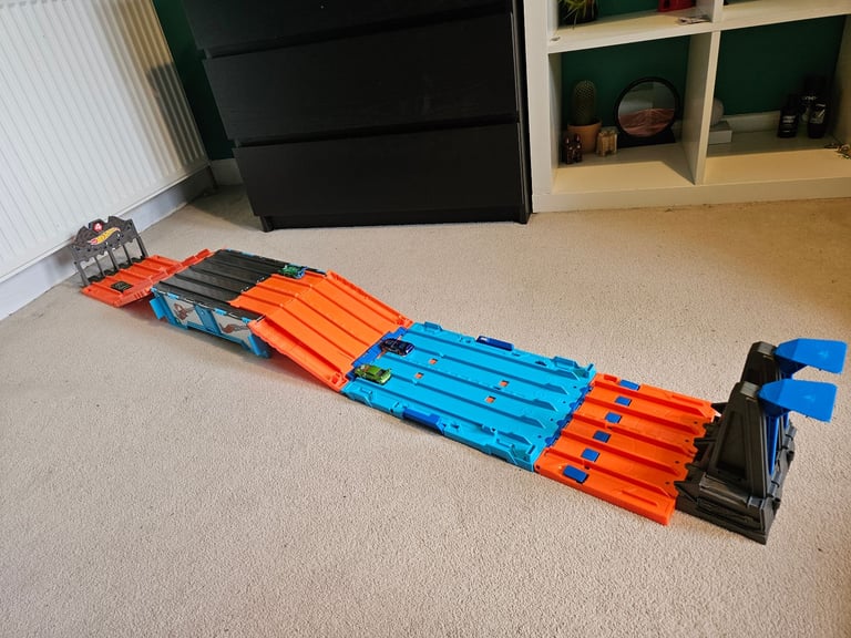Hot Wheels Action race track and Blastin' Rig transporter with cars