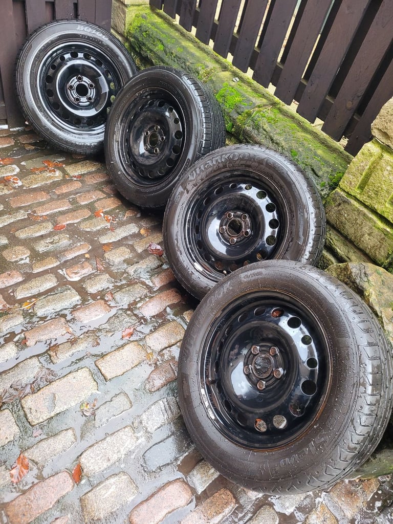 image for 4x ford 5 stud  steel wheels with good tyres size 205 60 16d tyres si