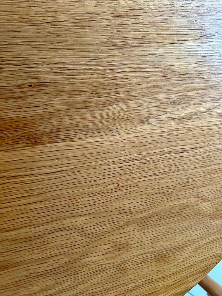 Solid oak dining table and four chairs