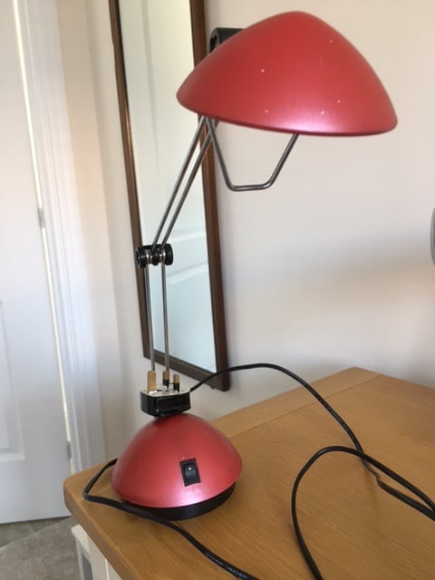 Red metal adjustable desk lamp