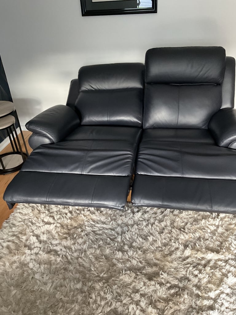 REDUCED PRICE    NEW 2 x 2 seater leather sofas 1 of which is a power recliner