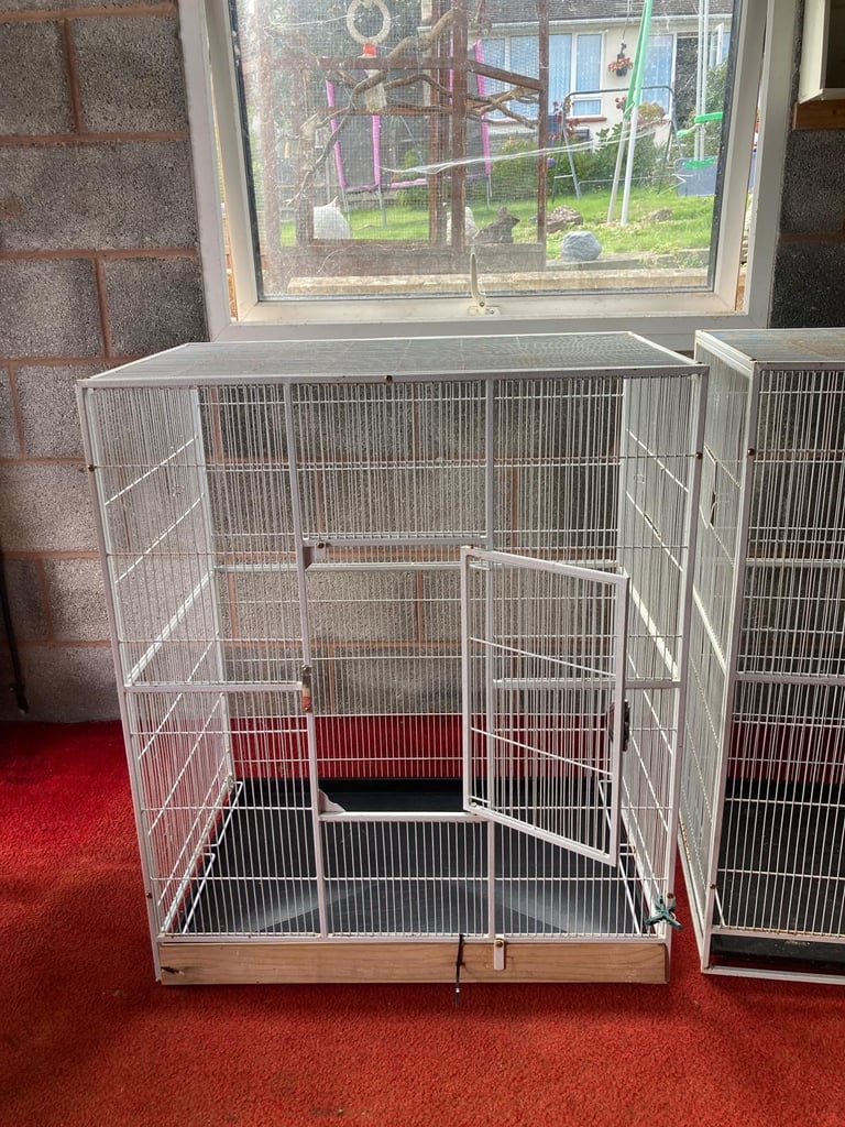 2 identical bird / parrot cages
