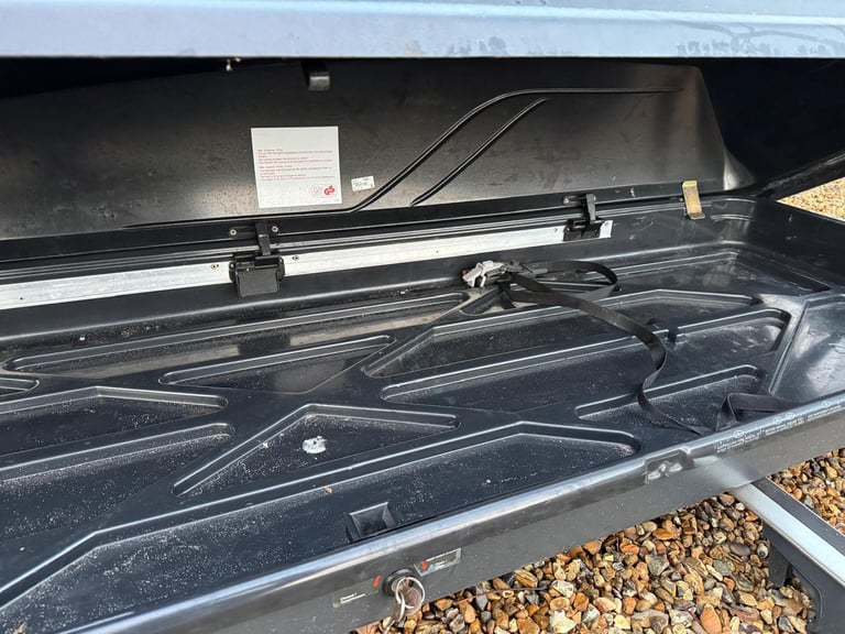 Used Thule roof box with roof bars included.