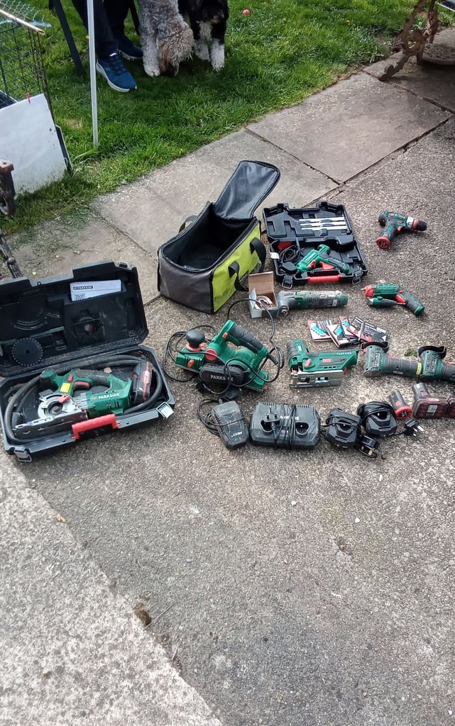 Collection of parkside tools with batteries and chargers.