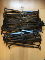 FREE approx 50 black plastic spring loaded style hangers for trousers and skirts