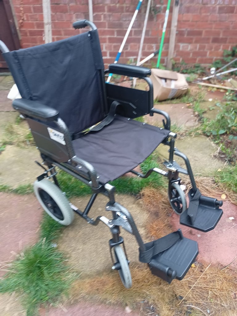 Folding Wheelchair in excellent condition has Padded Backrest and Seat can deliver 