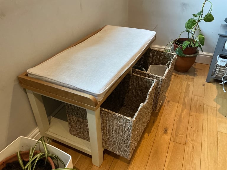 Small multipurpose storage and sitting cabinet.