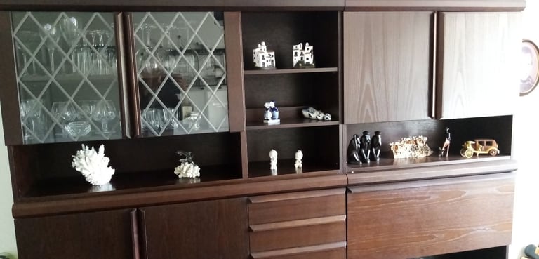Dark brown storage/ display/ cocktail bar combination wall cabinet.