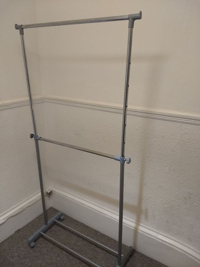 image for Clothes hanging dual rail. Adjustable height. shoe rack. On wheels.